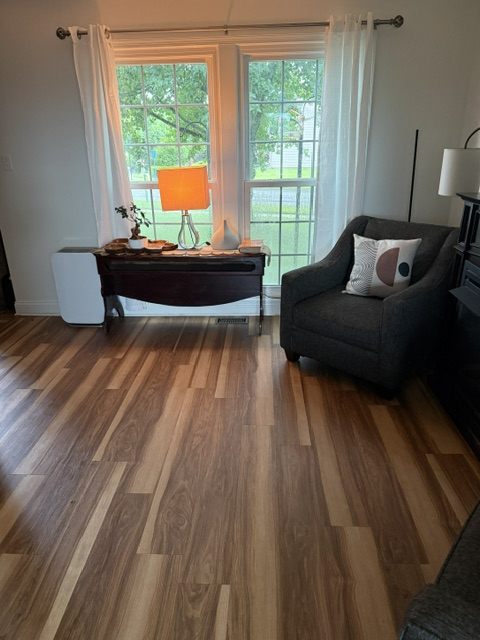 Finished luxury vinyl plank (LVP) flooring installation in a Moon Township living room