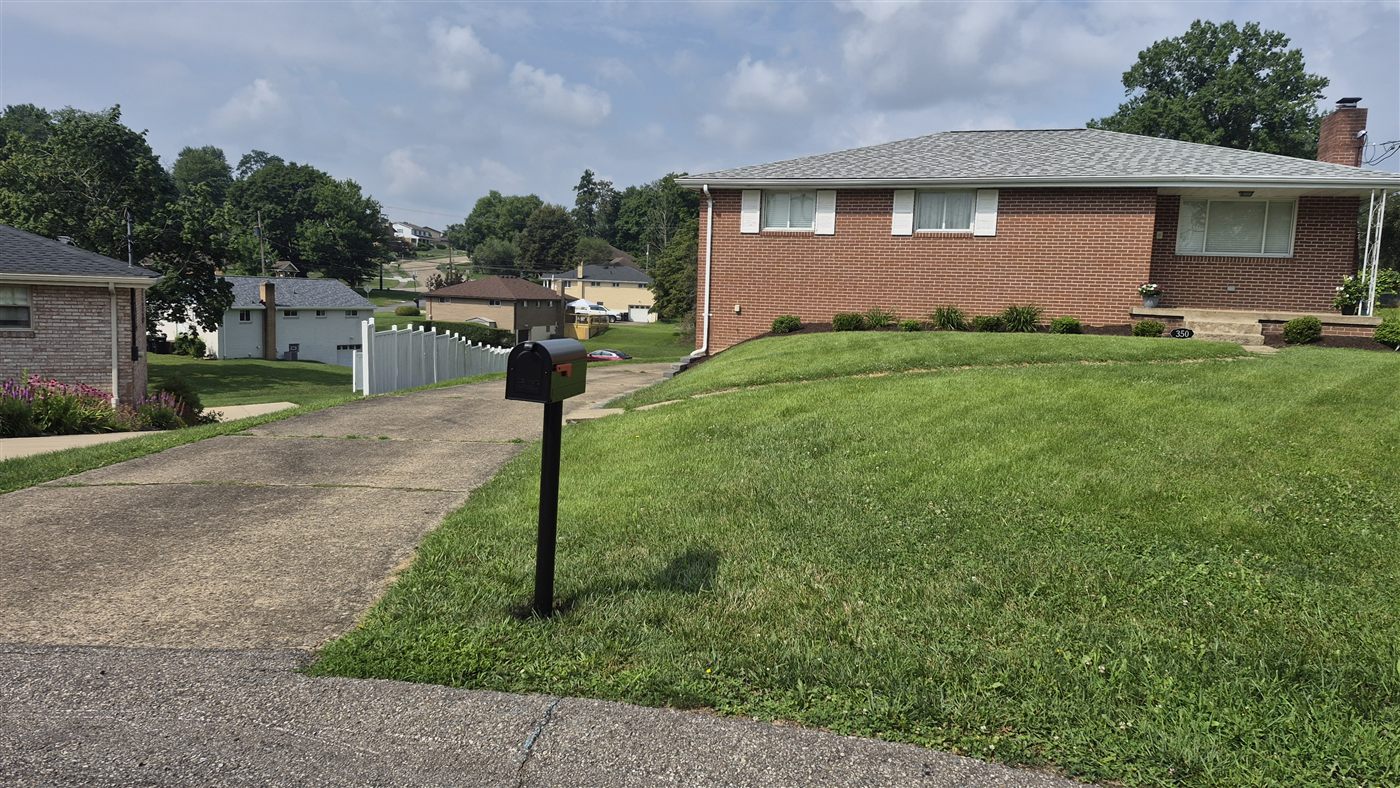 New mailbox post set in concrete in Robinson Township after replacement